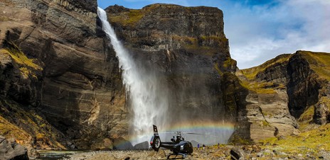 Spend the afternoon airborne in the heli for a waterfall and hot springs excursion